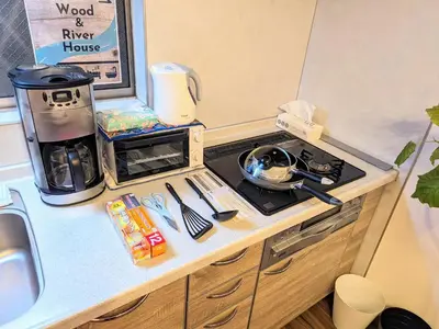 a toy kitchen with a stove and a sink at Wood River House \u9580\u524d\u4ef2\u753a\u99c5 \u6728\u5834\u99c5 in Tokyo