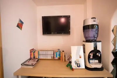 a coffee maker on a table in a room at Sato-san's Rest in Tokyo
