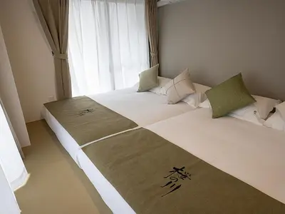 two beds in a room with a window at \u685c\u306e\u5ddd75 \u521d\u53f0\u99c55\u5206 2-4\u4eba\u4e285 minute from Hatsudai 2-4 people in Tokyo