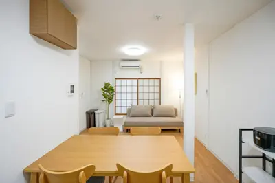 a living room with a table and a couch at BT House Bentencho Shinjuku Waseda in Tokyo