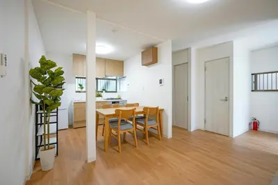 a kitchen and dining room with a table and chairs at BT House Bentencho Shinjuku Waseda in Tokyo