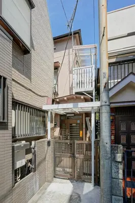 a house with a balcony on the side of it at BT House Bentencho Shinjuku Waseda in Tokyo