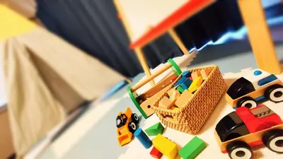 a toy car and a toy truck on a table at \u7f8e-yahiro- in Tokyo