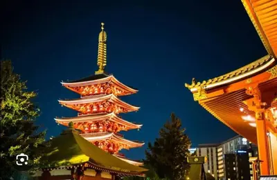 a lit up pagoda in front of a building at \u7f8e-yahiro- in Tokyo
