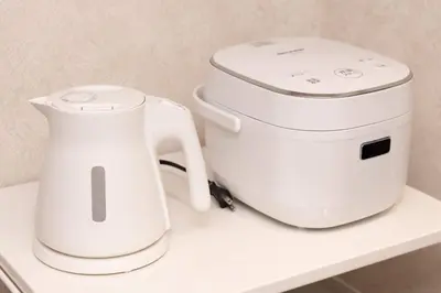 two white appliances sitting on a white shelf at Maison Shin Nakano 201 MS21 in Tokyo