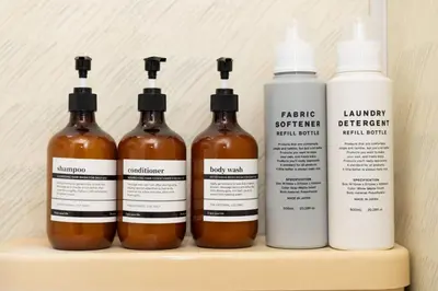 a group of four bottles of honey on a shelf at Maison Shin Nakano 201 MS21 in Tokyo
