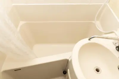 a white bath tub with a toilet in a bathroom at Maison Shin Nakano 201 MS21 in Tokyo