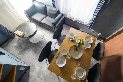 a dining room table with chairs and a couch at Chill Place 124 Horikiri Shobuen in Tokyo