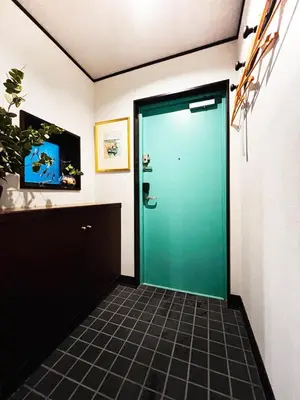 a green door in a room with a tile floor at Shibuya 10 min Walk Theater & Garden Stay Max 6ppl in Tokyo
