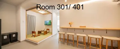 a room with a bar with stools and a mirror at 5-Min Walk to Yamanote Line, Newly Renovated APT in Prime Location, Quiet Neighborhood in Tokyo