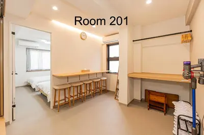 a room with a bed and a room with a mirror at 5-Min Walk to Yamanote Line, Newly Renovated APT in Prime Location, Quiet Neighborhood in Tokyo
