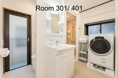 a bathroom with a washing machine and a sink at 5-Min Walk to Yamanote Line, Newly Renovated APT in Prime Location, Quiet Neighborhood in Tokyo