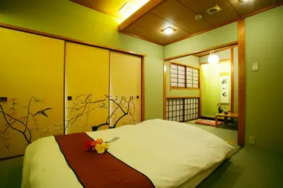 a bedroom with a bed with flowers on it at \u30db\u30c6\u30eb \u30b0\u30ea\u30fc\u30f3\u30d2\u30ebAdult only in Tokyo