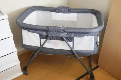 a gray and white high chair sitting in a room at Cozy house Tokyo in Tokyo