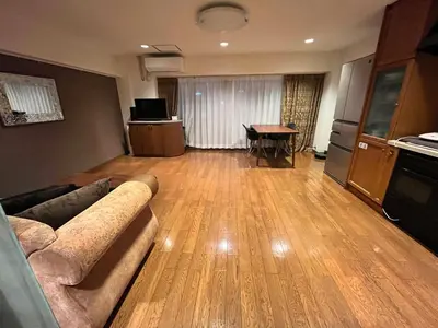 a living room with a couch and a table at staytokyo1107 ONE bedroom in Tokyo
