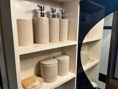 a shelf with toilet paper rolls in a bathroom at staytokyo1107 ONE bedroom in Tokyo