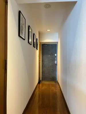 a hallway with a door and a wooden floor at staytokyo1107 ONE bedroom in Tokyo
