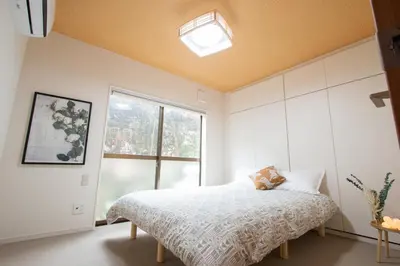 a bedroom with a bed and a window at Ikebukuro# Nakaitabashi 3DK room# 5 minutes walk from station in Tokyo