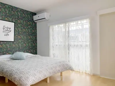 a bedroom with a bed and a window at Ikebukuro# Nakaitabashi 3DK room# 5 minutes walk from station in Tokyo