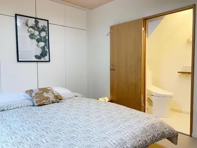 a bedroom with a bed and a toilet at Ikebukuro# Nakaitabashi 3DK room# 5 minutes walk from station in Tokyo