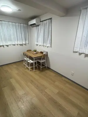 a room with a table and chairs in it at \u5c71\u624b\u7dda\u5927\u585a in Tokyo