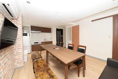 a kitchen and dining room with a table and chairs at NY House 2\u65b0\u5bbf\u4e09\u968e\u5efa\u30663\u5ba42\u30b7\u30e3\u30ef\u30fc2\u30c8\u30a4\u30ec in Tokyo