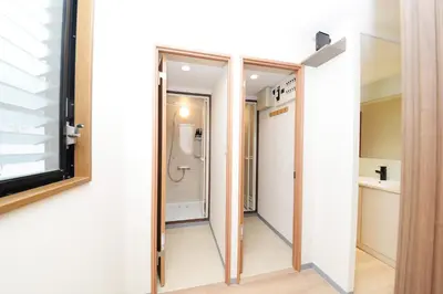 a bathroom with a walk in shower and a glass door at NY House 2\u65b0\u5bbf\u4e09\u968e\u5efa\u30663\u5ba42\u30b7\u30e3\u30ef\u30fc2\u30c8\u30a4\u30ec in Tokyo