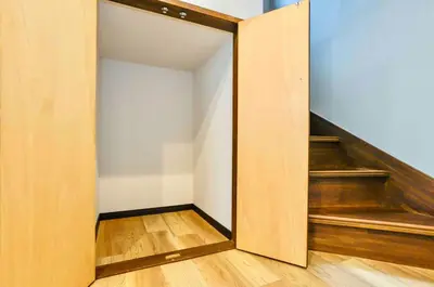 an open door to a room with stairs at Tanuki Apartment Shinjuku West in Tokyo