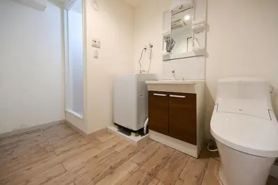 a bathroom with a white toilet and a sink at Home Story in Tokyo Uguisudani\u30e9\u30a4\u30ba\u65e5\u66ae\u91cc \u6771\u4eac\u5c4b\u8a9e in Tokyo