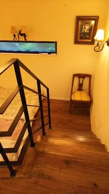 a room with a staircase with a chair and a window at Dreamy Music Cafe Bar in Tokyo