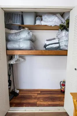 a closet filled with lots of pillows at Oji Inn \u738b\u5b50\u30a4\u30f3 in Tokyo