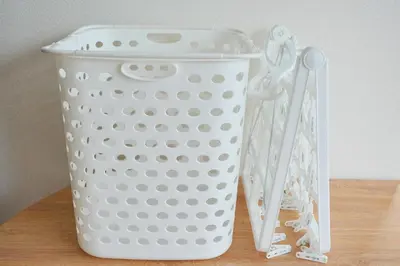 a white basket sitting on a table with scissors at Mari Hotel in Tokyo