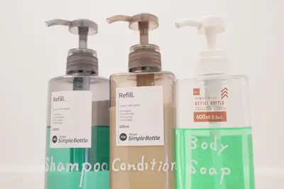 a group of three bottles of soap sitting next to each other at Mari Hotel in Tokyo