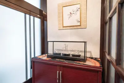 a room with a table with bowls on it at SAKURA villa \uff21166 in Tokyo