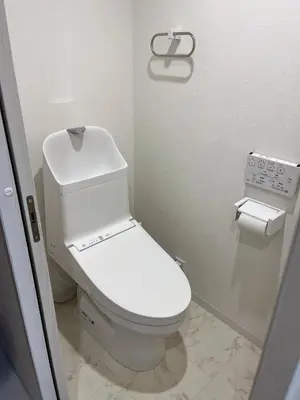 a bathroom with a white toilet in a stall at \u6d45\u8349\u6c11\u6cca301 in Tokyo