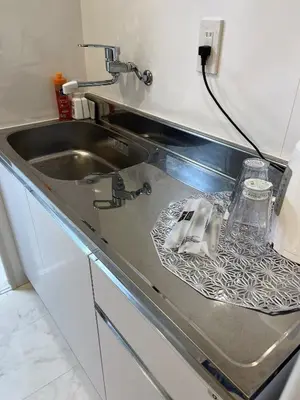a kitchen counter with a sink and a sink at \u6d45\u8349\u6c11\u6cca301 in Tokyo