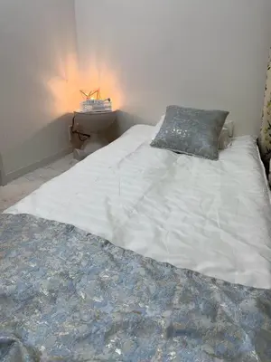a large white bed with a pillow on top of it at \u6d45\u8349\u6c11\u6cca301 in Tokyo
