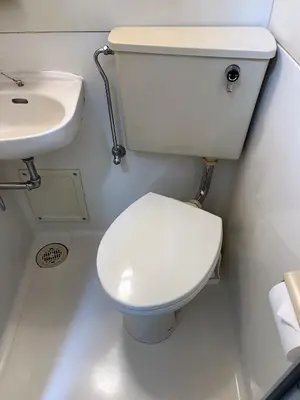a bathroom with a toilet and a sink at \u6d45\u8349\u6c11\u6cca303 in Tokyo