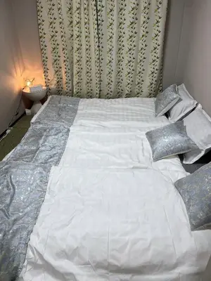 a large white bed with pillows in a bedroom at \u6d45\u8349\u6c11\u6cca303 in Tokyo