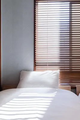 a bedroom with a white bed and a large window at HouseHotel\u4e94\u53cd\u7530 in Tokyo