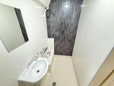 a bathroom with a sink and a mirror at Shinjuku Area 5F Shinjuku Apartment No elevator in Tokyo