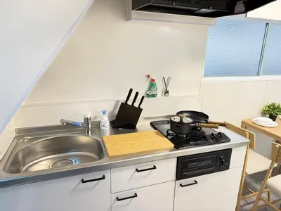 a kitchen with a sink and a stove at Shinjuku Area 5F Shinjuku Apartment No elevator in Tokyo