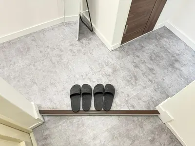 two black slippers on the floor of a room at Shinjuku Area 5F Shinjuku Apartment No elevator in Tokyo