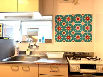 a kitchen with a sink and a stove at Retro Showa Home 9min from station Direct to Narita Near Disney Bus 48mim in Tokyo