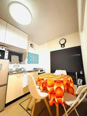 a kitchen with a table and chairs in a kitchen at Retro Showa Home 9min from station Direct to Narita Near Disney Bus 48mim in Tokyo