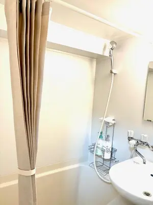 a bathroom with a tub and a sink at 1min from station Hokusai and 2F nice view 2DK 30min from Tokyo station convenience store 30sec onsen 10min Haneda 55min in Tokyo