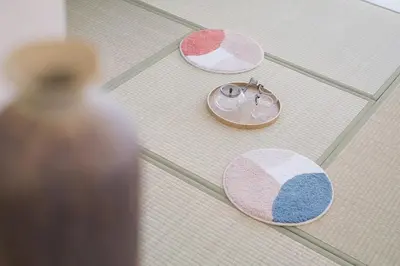 three different colored circles on the floor with a vase at Good access to Shinjuku! Japandi Style Room in Nakano, Tokyo - Podhouse Nakano in Tokyo