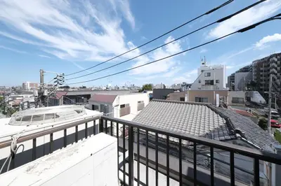 a balcony with a view of a city at Good access to Shinjuku! Japandi Style Room in Nakano, Tokyo - Podhouse Nakano in Tokyo