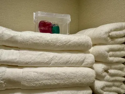 a stack of toilet paper towels in a bathroom at Private Room near Iriya in Tokyo