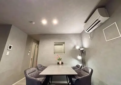 a room with a table and chairs in a room at Opening SALE! Stylish Room in Meguro Near Shibuya! in Tokyo